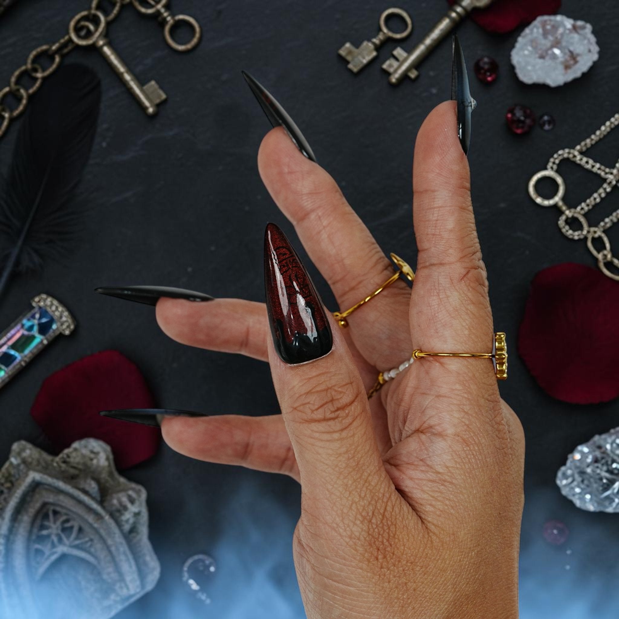 DSC00041 dramatic long stiletto vampire press on nails on a dark gothic flat lay