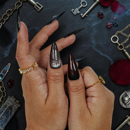DSC00042 long stiletto vampire press on nails with dark red cat eye and gothic lettering