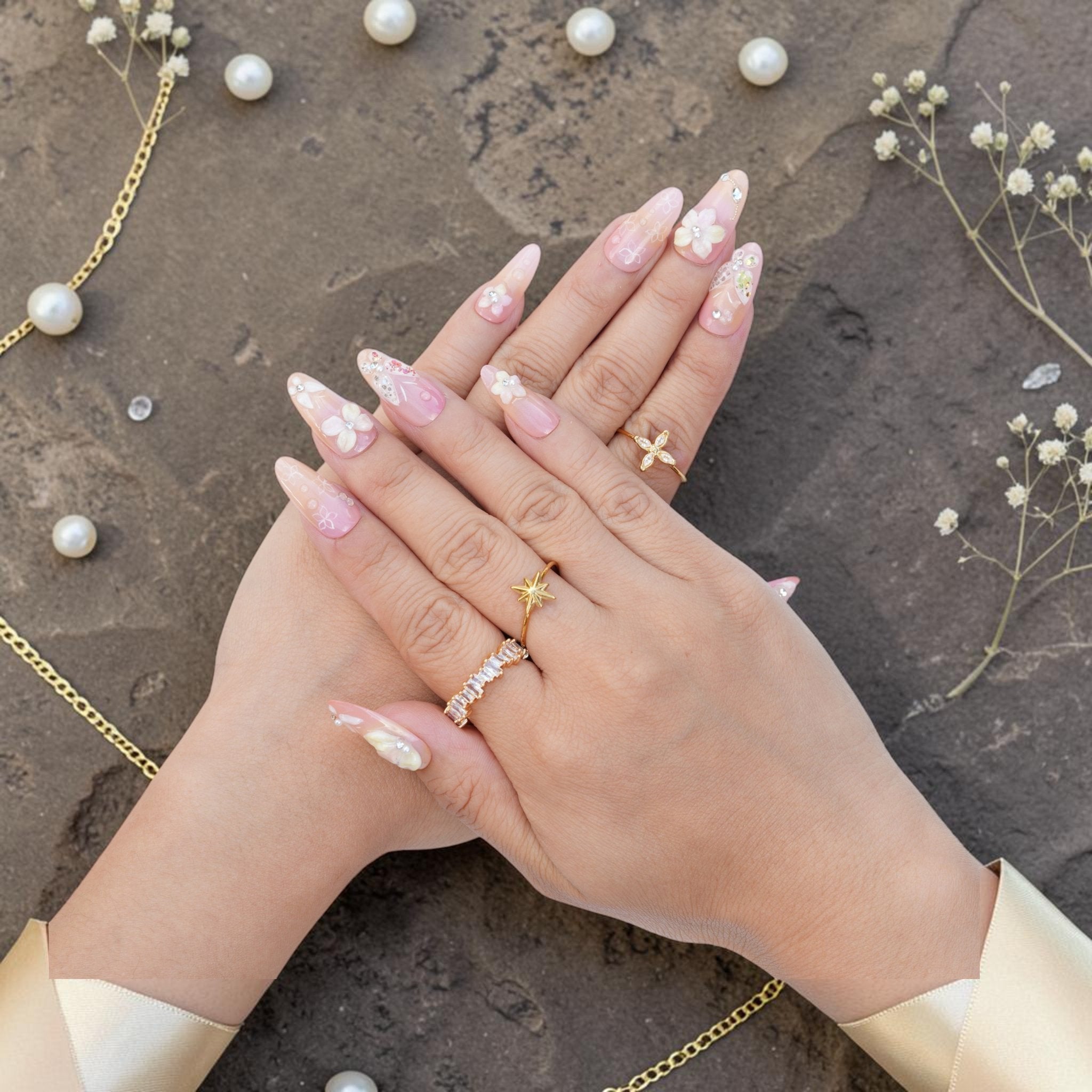 DSC00044 hands wearing pink almond press on nails with 3D flowers and gold rings