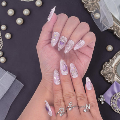 DSC00054 hands wearing lavender press on nails with 3D purple hearts, silver bows and pearls