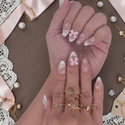 DSC00062 hands wearing bow press on nails with 3D pink bows, flowers and white french tips