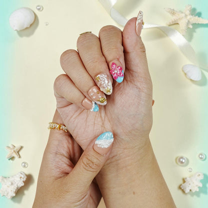 DSC00064 close up of tropical press on nails with a pink hibiscus, pearls and aqua shimmer