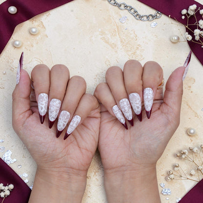 DSC00068 pair of hands showing burgundy lace press on nails from the front