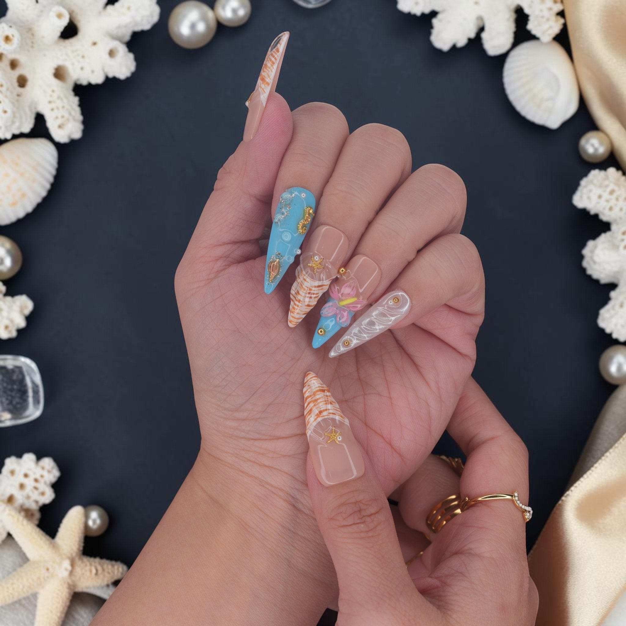 DSC00068 close up of mermaid press on nails with gold starfish, seahorse and 3D pink flower