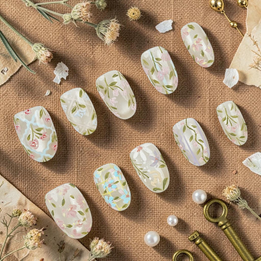 DSC00070 wildflower press on nails full set hand painted with daisies sweet peas and greenery laid flat