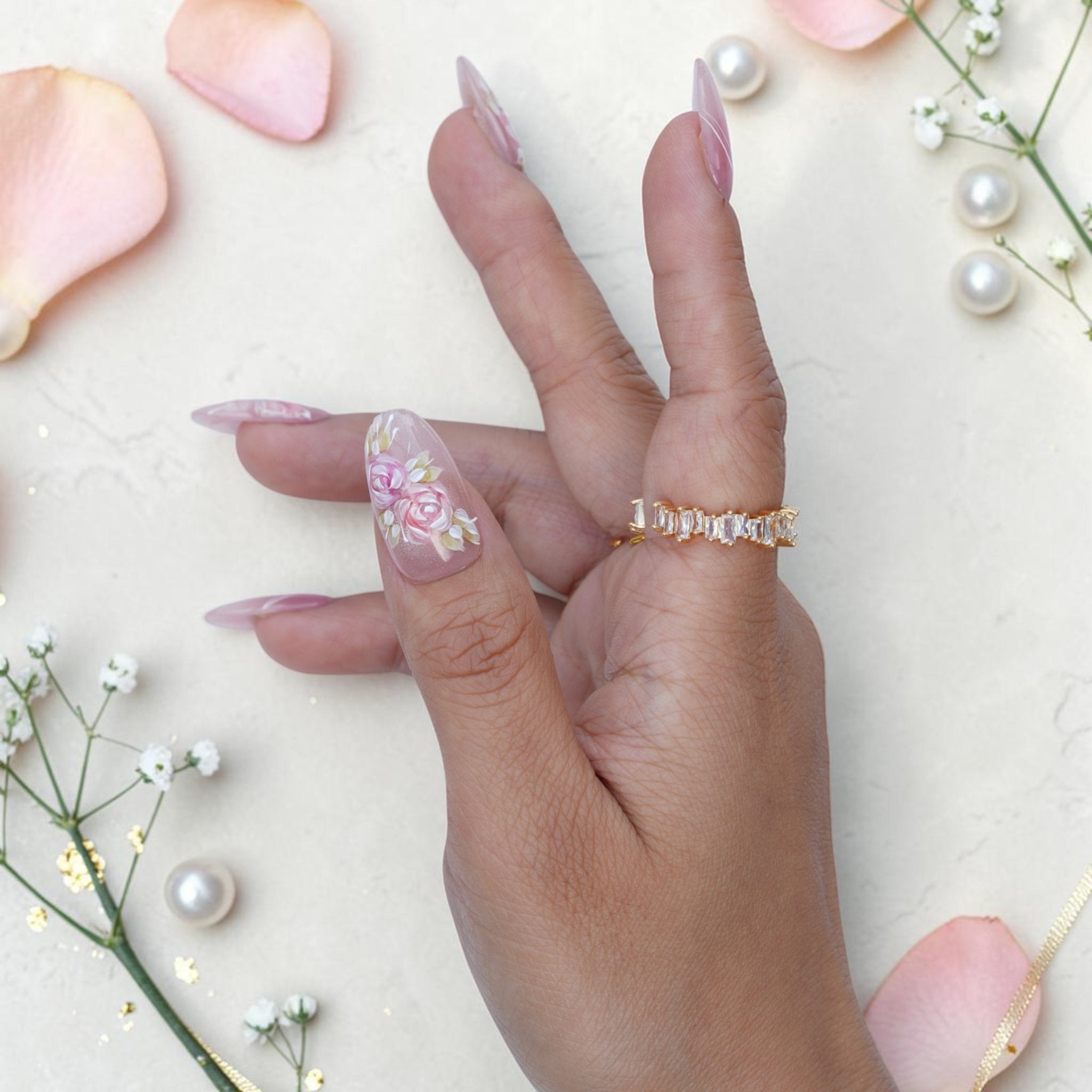 Watercolor rose press on nails close up with hand painted pink roses and gold leaves