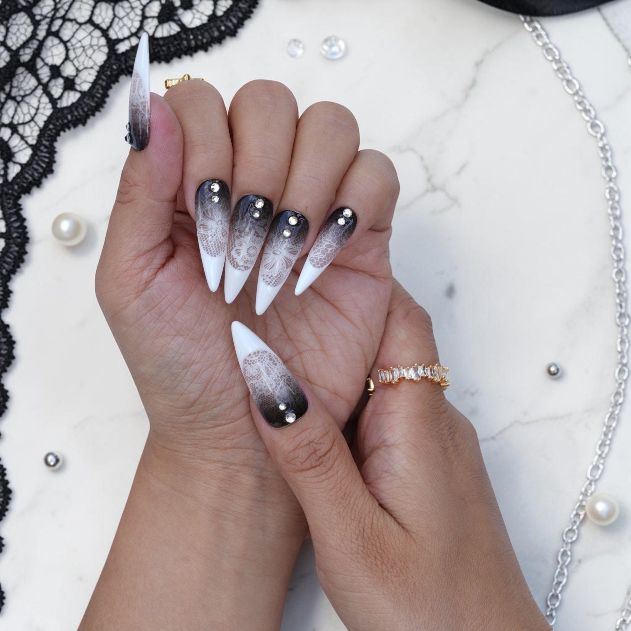 Long stiletto lace press on nails with black to white ombre and rhinestones