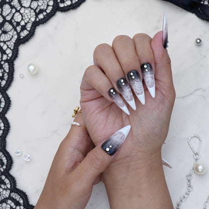 Smoky ombre stiletto press on nails with white lace and clear gems on hand