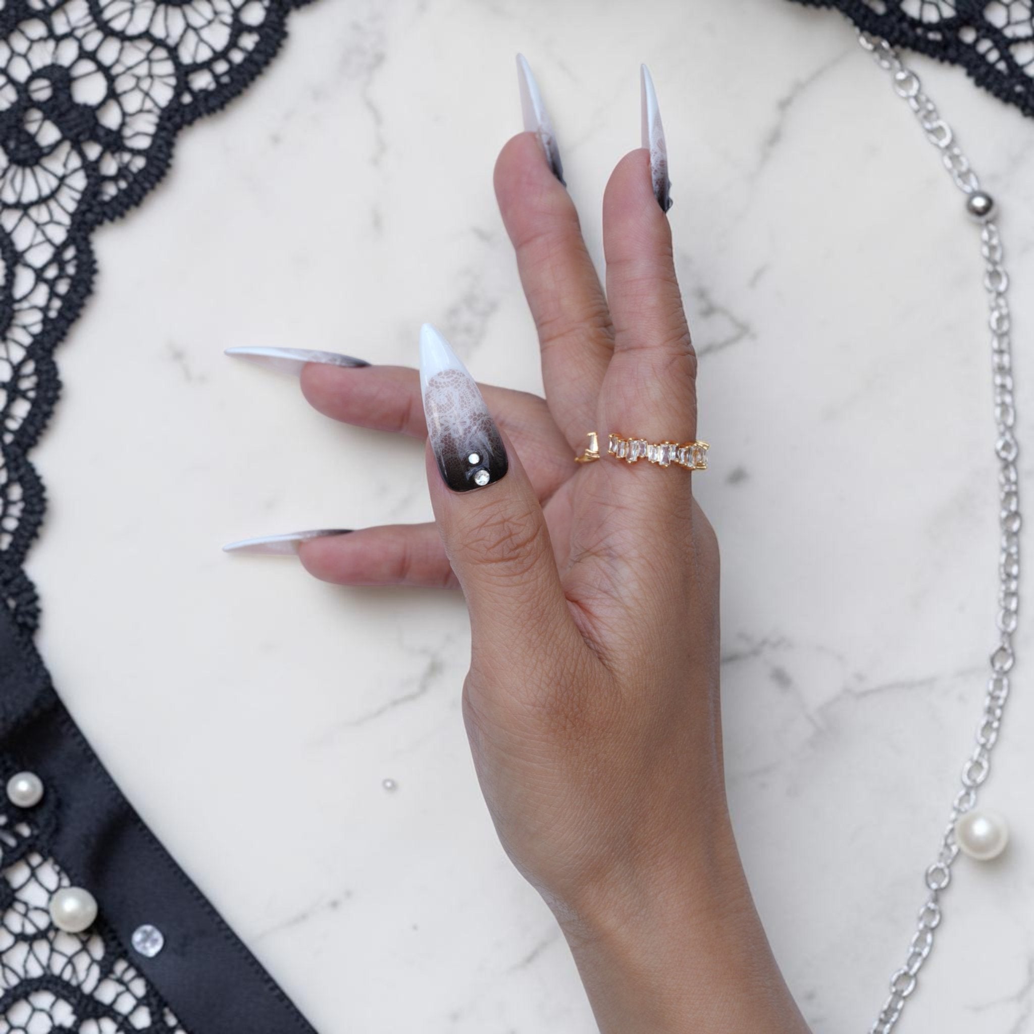 Black Veil lace press on nails with pointed white tips and lace detail