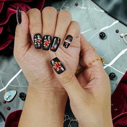 DSC00086 close up of gothic press on nails with red rhinestone cluster and studs on black
