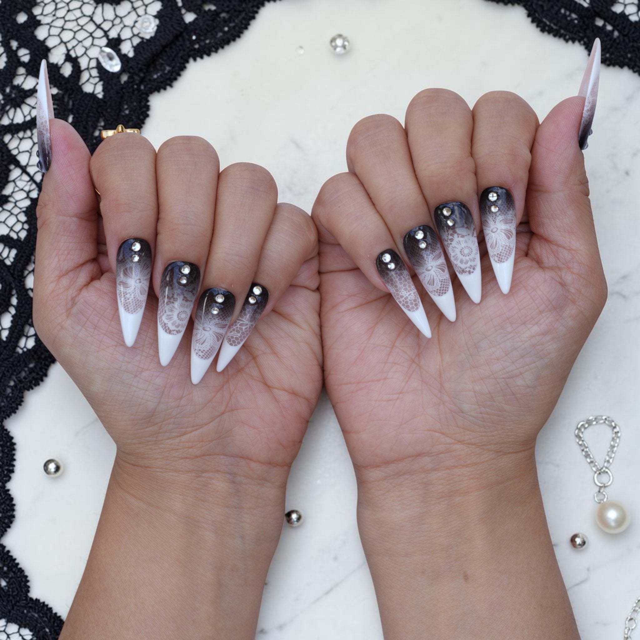 Black Veil lace press on nails set on both hands with stiletto tips and crystals