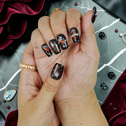DSC00087 close up of black cat eye gothic press on nails with red hearts