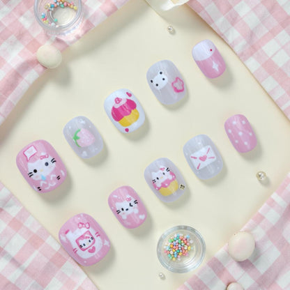 Handmade cute cat press on nails flat lay in pink and white with kittens, cupcakes, strawberry and love letters