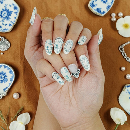 DSC00094 handmade porcelain press on nails in blue and white on a vintage china flat lay