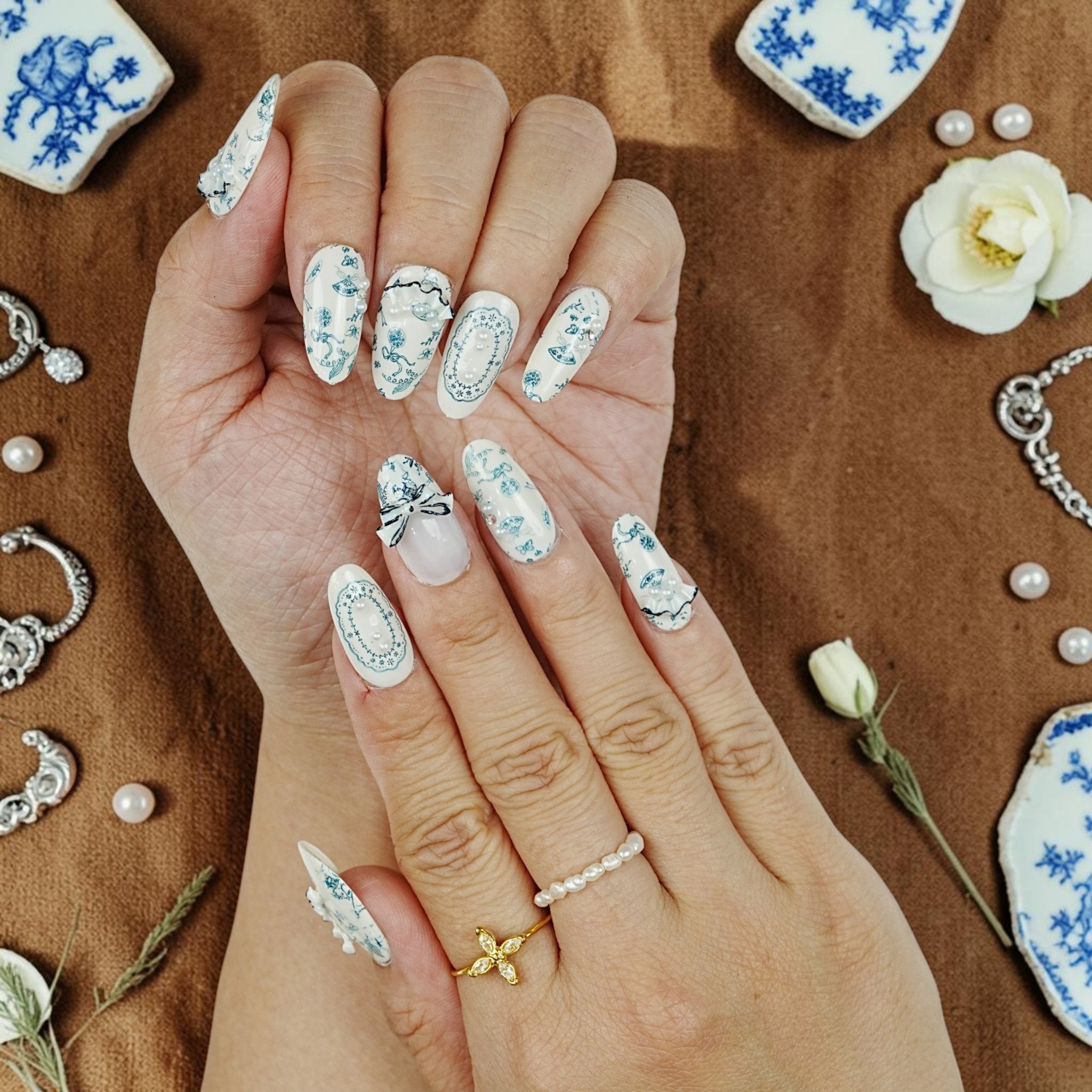 DSC00095 close up of porcelain press on nails with blue florals butterflies and 3D lace