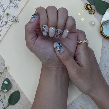 Pearl cat eye press on nails with a hand painted bluebird on a blossom branch