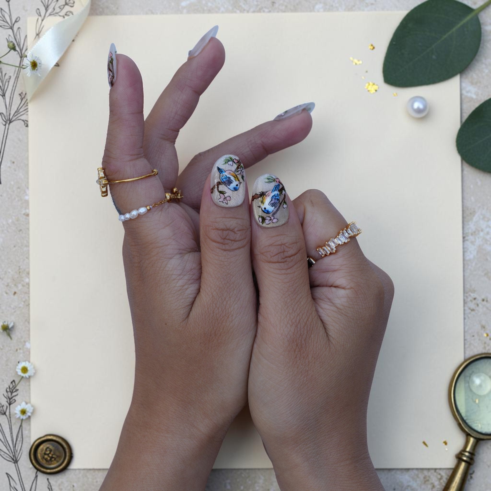 Hand painted bird press on nails with bluebird, blossoms and cat eye shimmer