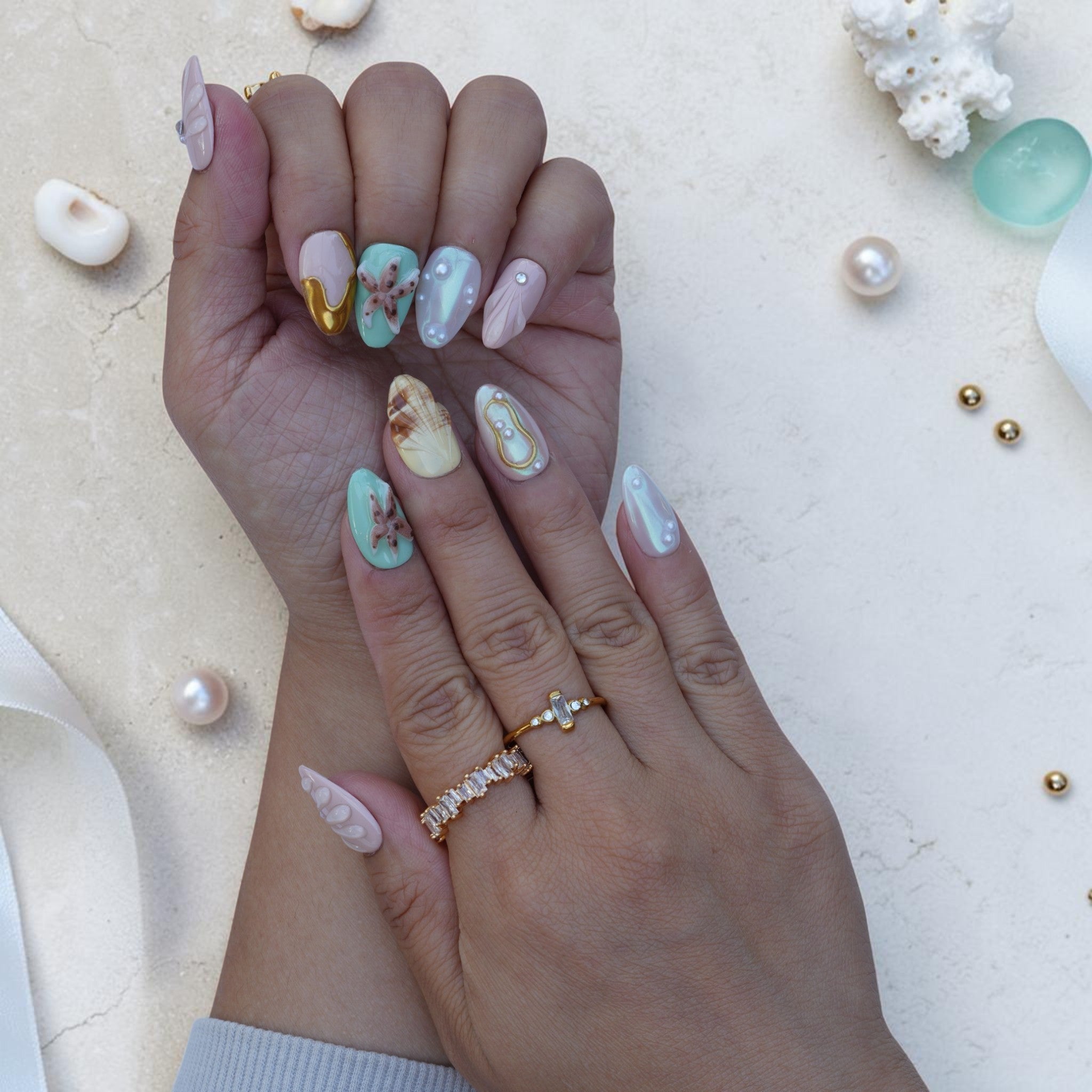 Tide Pool press on nails close up with starfish, seashell and pearl accents