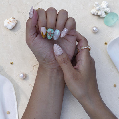 Pastel almond press on nails with gold waves, pearls and aura shimmer