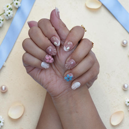 Handmade beach press on nails close up with seashells, starfish and 3D flowers