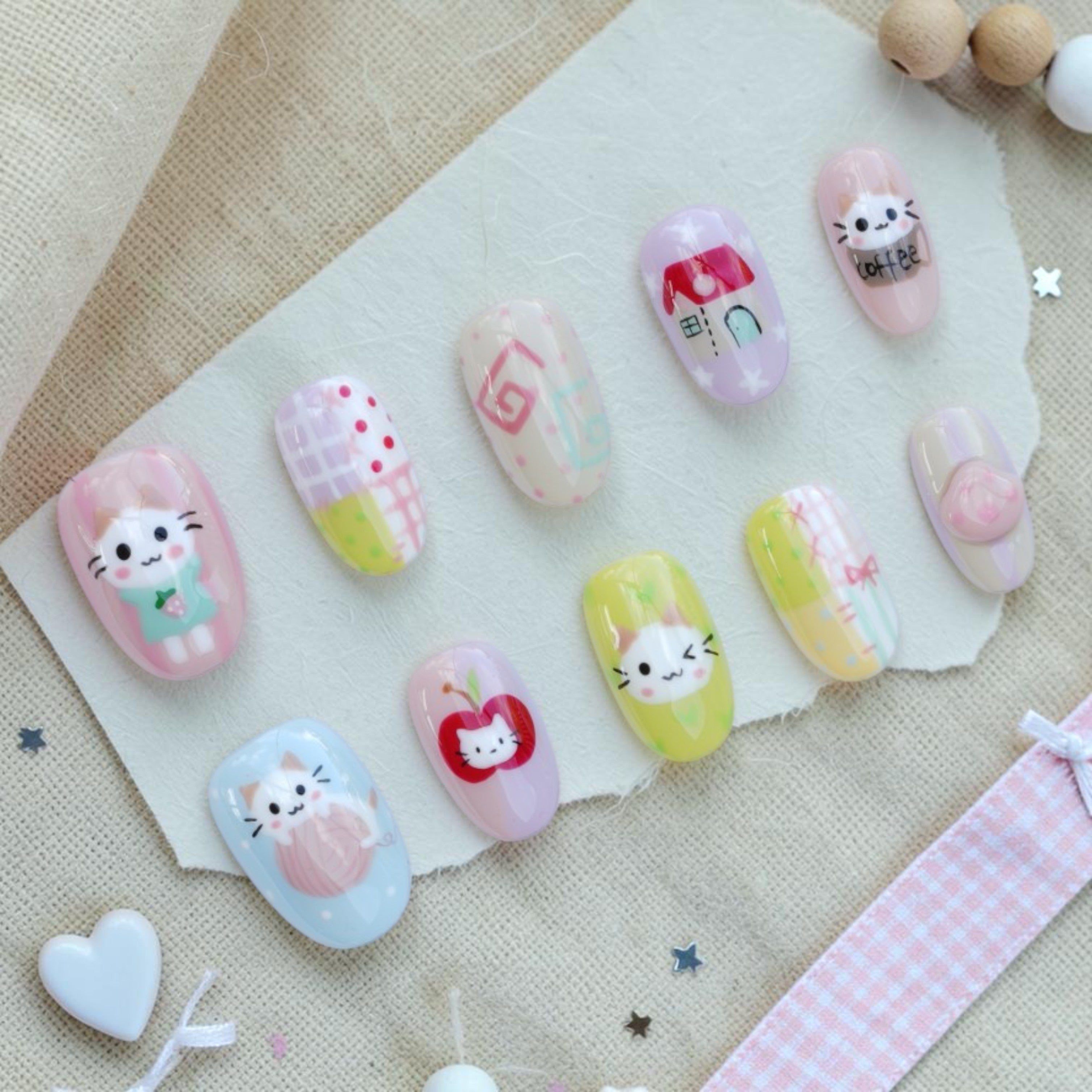 Kitty Cafe kawaii press on nails full set in pastel colours with cute cat art