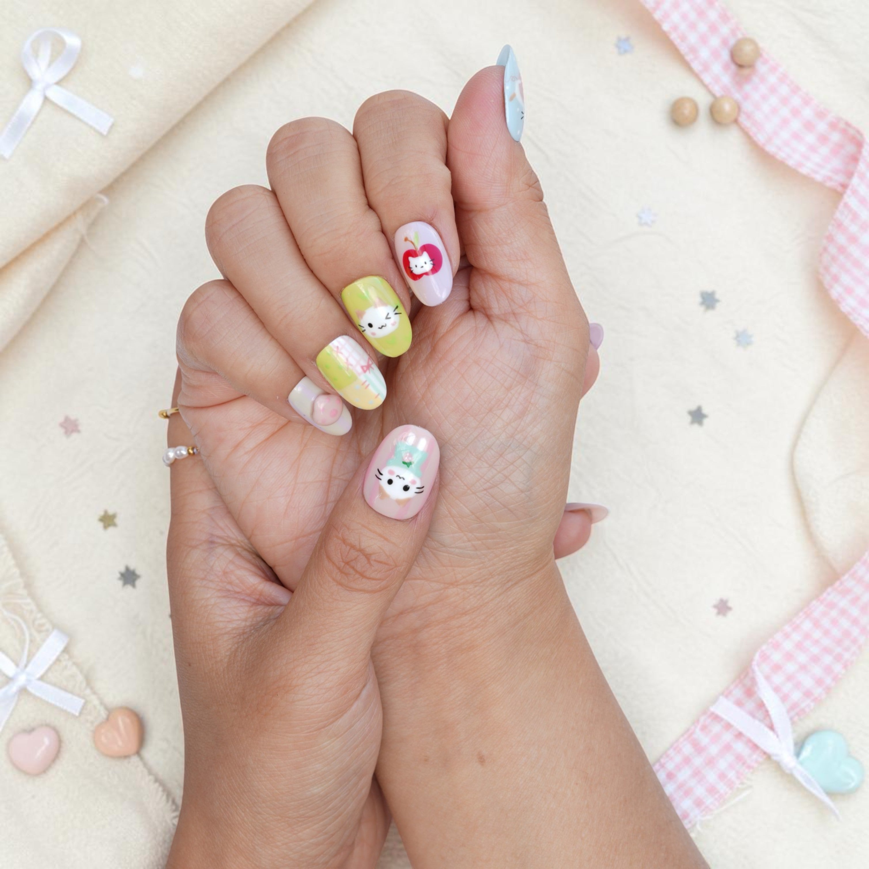 Playful cat press on nails in mint and pink pastels