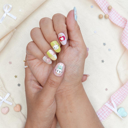 Playful cat press on nails in mint and pink pastels