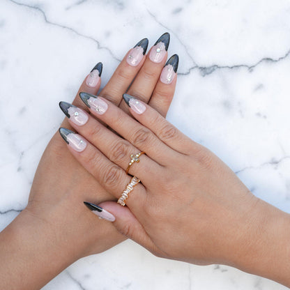 Almond press on nails with smoky cat eye French tips and silver star art