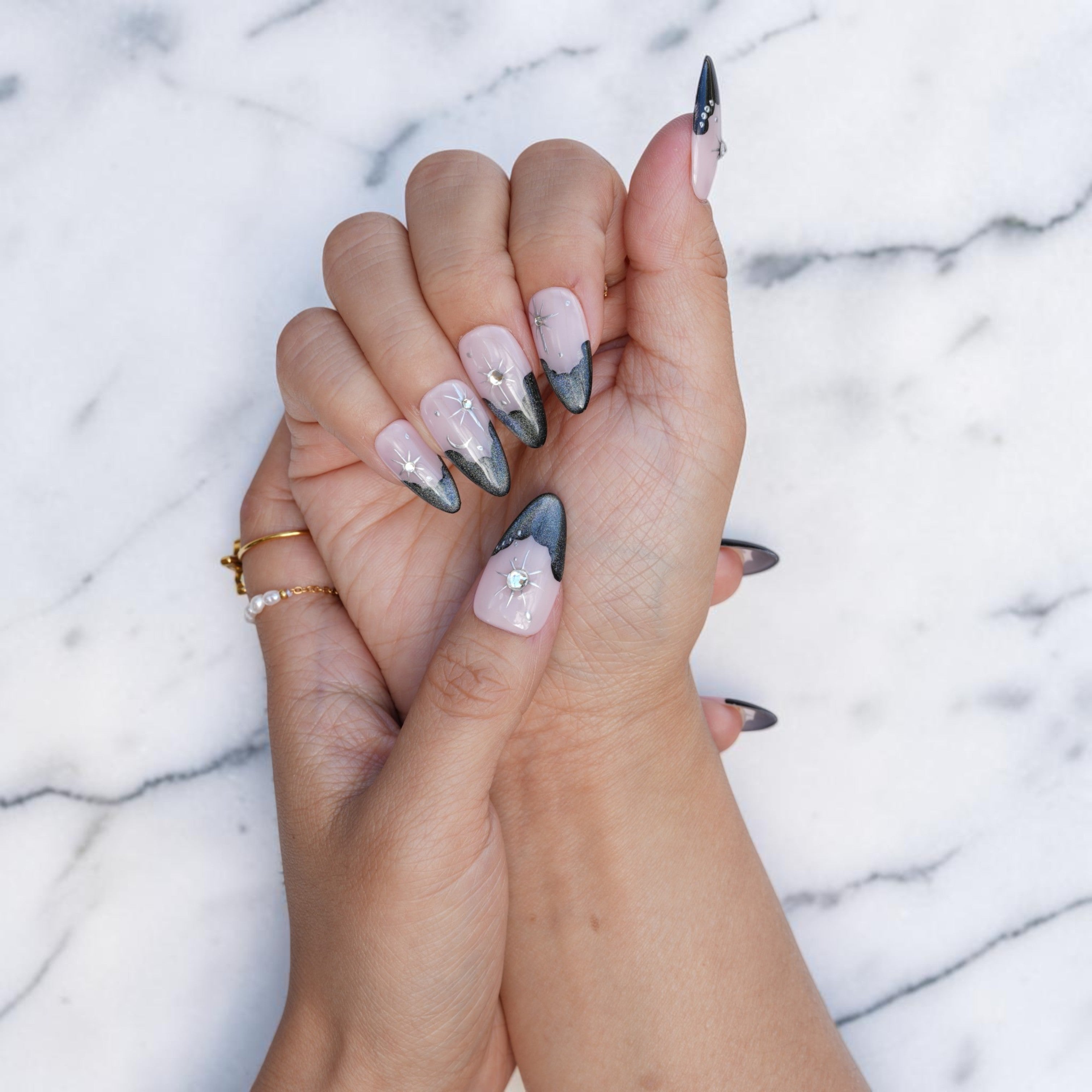Celestial almond press on nails with smoky tips and a gem accent