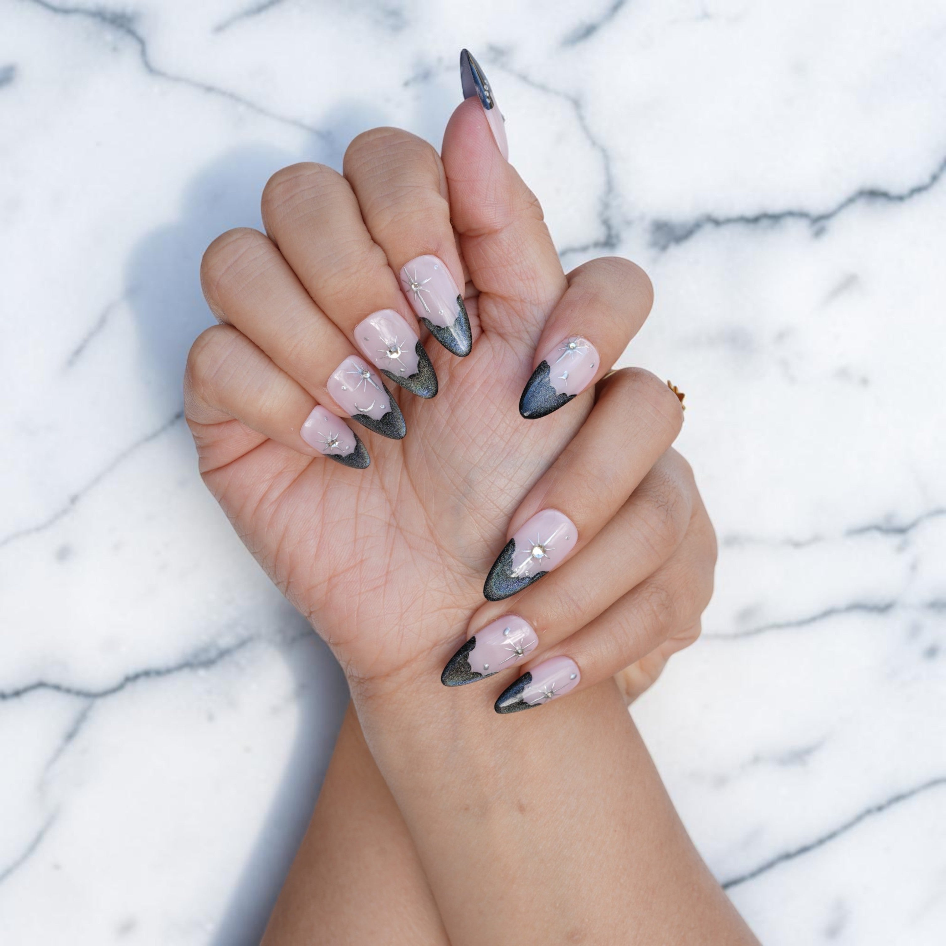 Edgy black French tip press on nails with cat eye shimmer