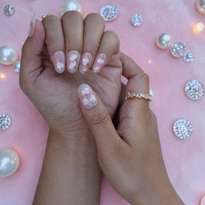 Bridal style nude press on nails with painted magnolias and green stems