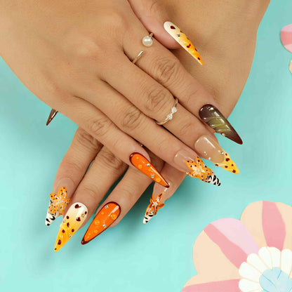 closeup of orange and brown floral handmade press on nails Australia