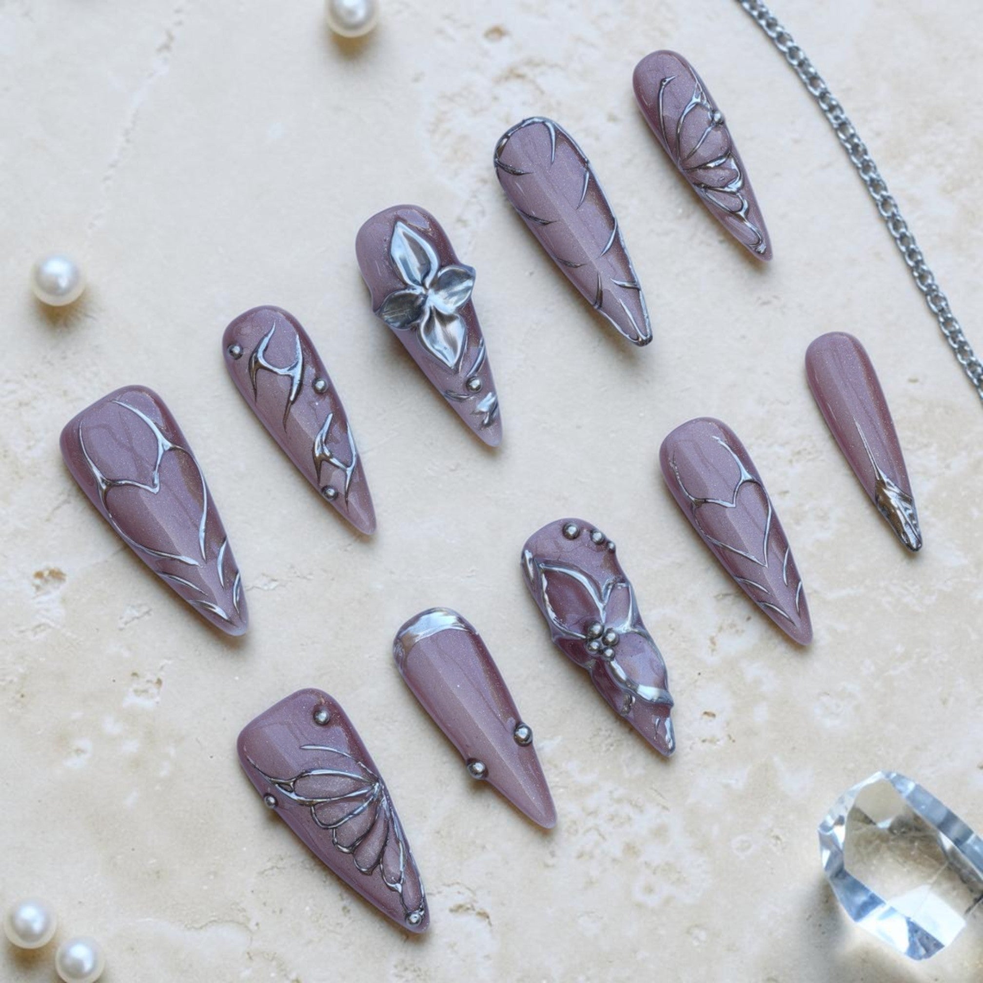 Silver Fae stiletto press on nails, full set of 10 in mauve with silver 3D flowers and butterfly art