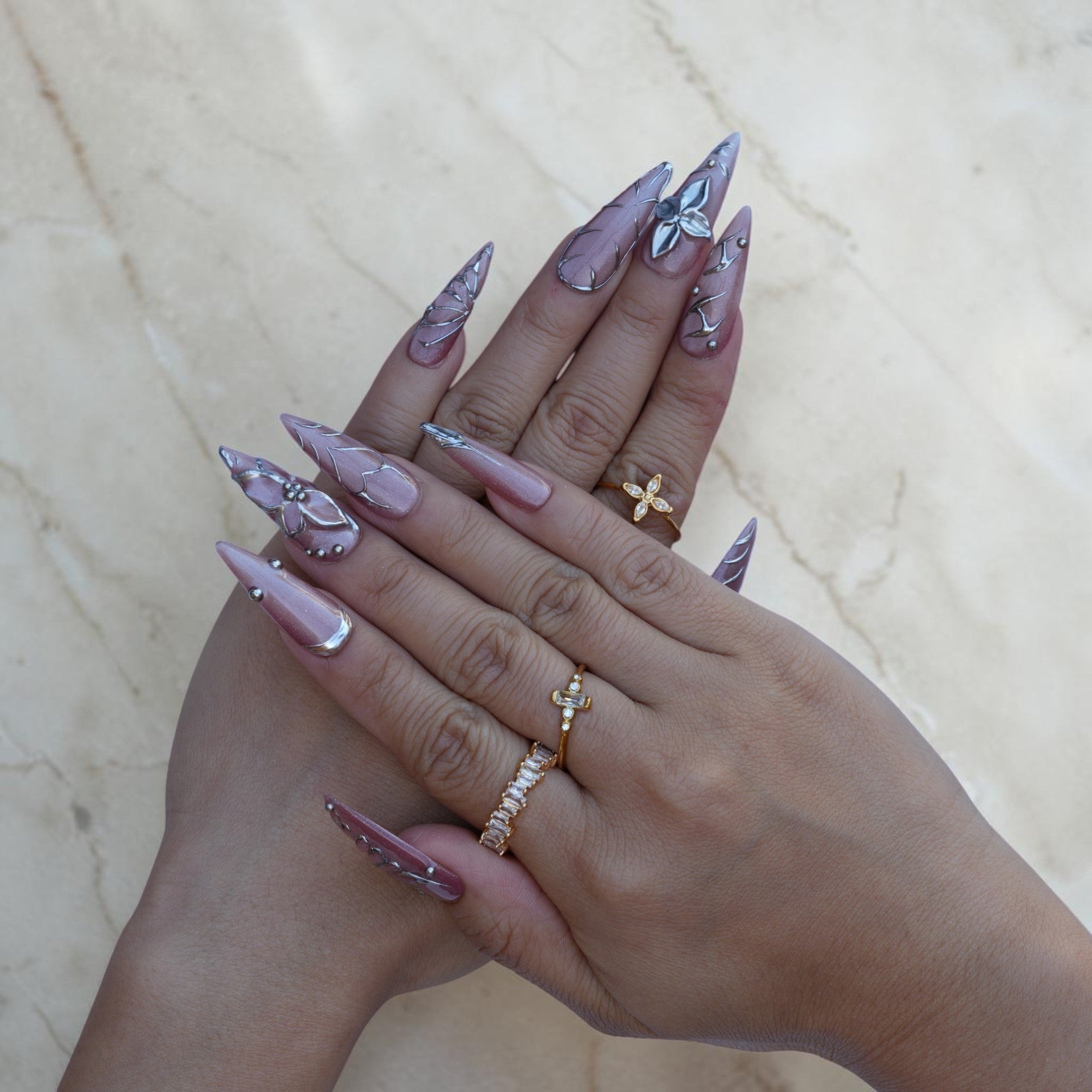 Long stiletto press on nails in smoky mauve with silver butterfly and floral art