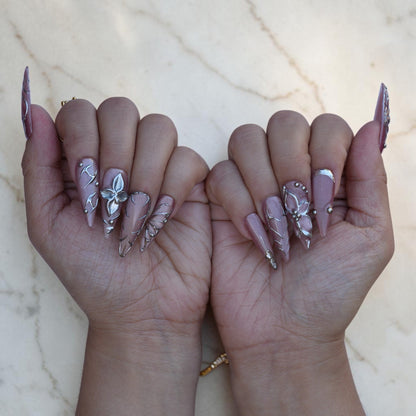 Silver 3D flower on a smoky mauve stiletto press on nail close up