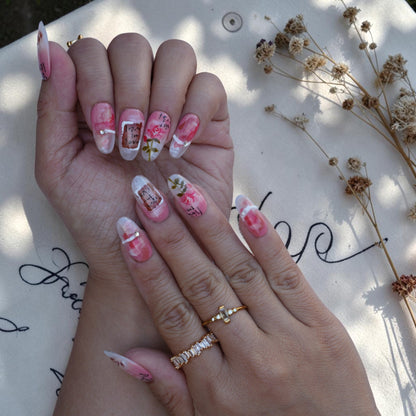 Long almond press on nails with pink roses and handwritten script