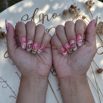 Both hands wearing Love Letter vintage rose press on nails set