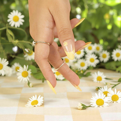 Reusable flower press ons with spring yellow color and soft petal art.