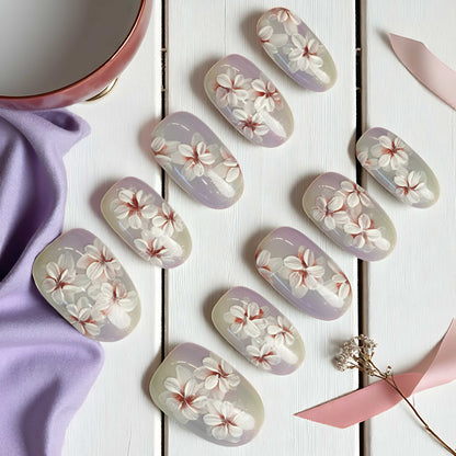 Nail art stickers with floral design on a white wooden surface