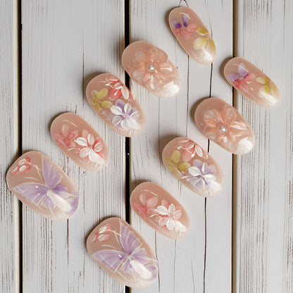 Stick on nails featuring spring florals, 3D petal work, and soft shimmer finish