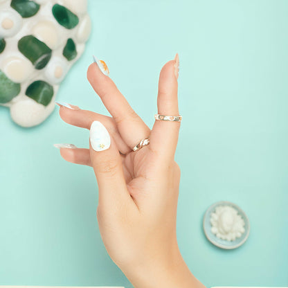 Handcrafted press on nails with pastel wave textures and mini seashells – ocean girl aesthetic.