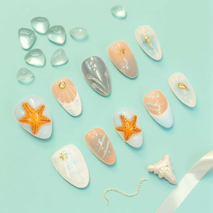 Minimalist summer press on nails with flowing waterlines and seashell textures – easy beach style.

