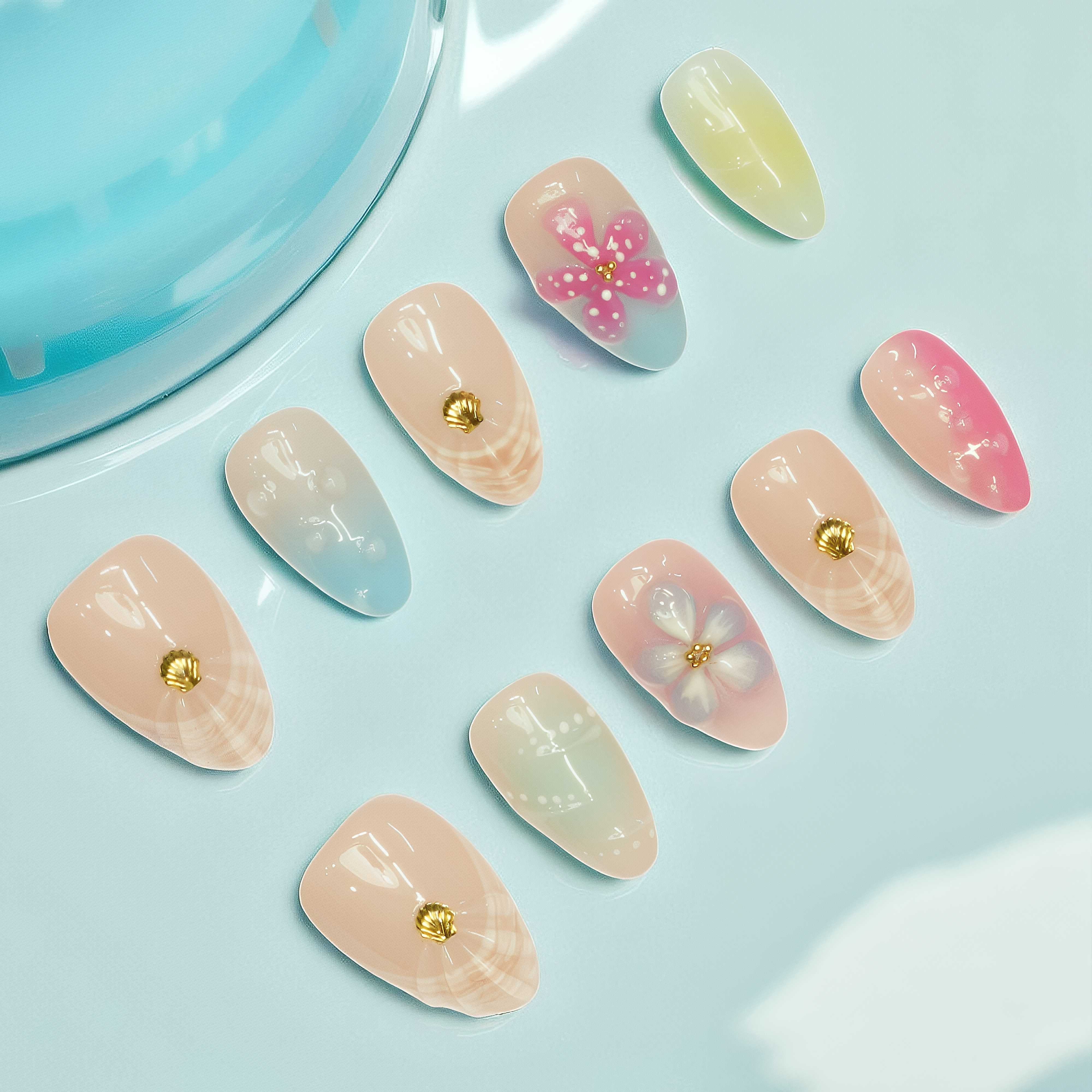 variety of short pastel nails with floral details, inspired by the best nail salon looks in Adelaide.

