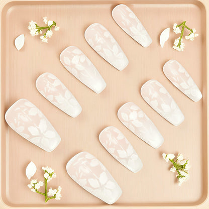 Delicate white floral press on nails with soft pink base and coffin shape, handmade for elegant wear