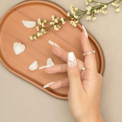 Candy Bloom Claws featuring white floral accents on pink coffin nails, reusable and stylish