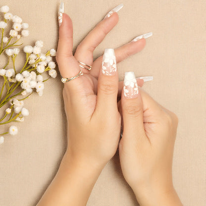 Hand-painted white flowers on soft pink coffin-shaped false nails, press on nail set Australia