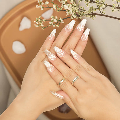 Candy Bloom Claws featuring hand-painted white flowers and soft pink base, elegant nail tips