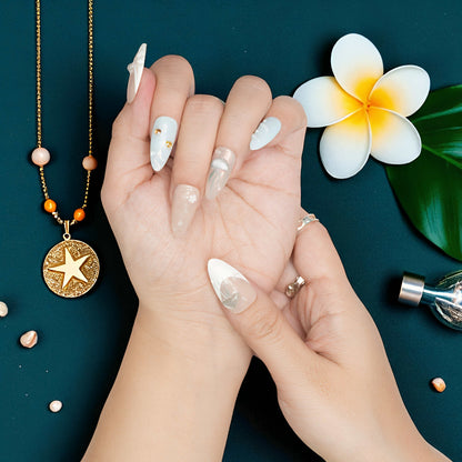 Ocean-inspired press on nail with sculpted blue jellyfish and pearl accents