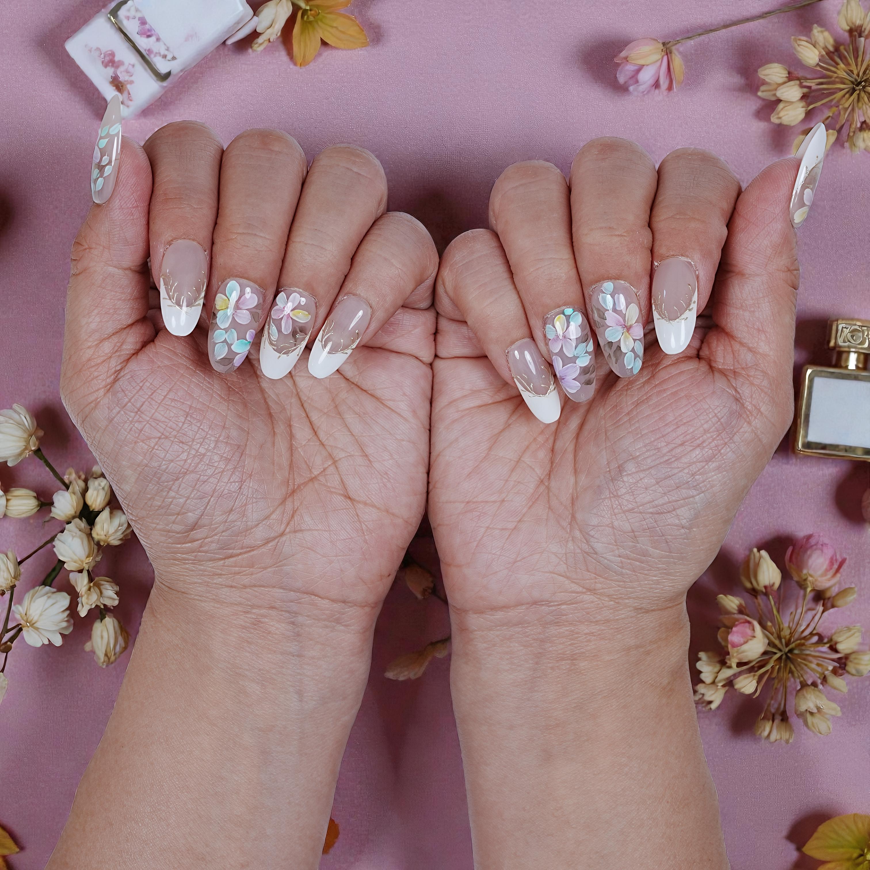 Close-up of Blooming Mist stick on nails with glossy finish and detailed flower artwork
