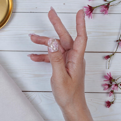 Top view of the full nail set laid out on soft fabric